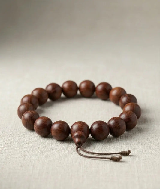 Cambodia wooden beaded bracelet on a textured beige background available at TukTuk Trading