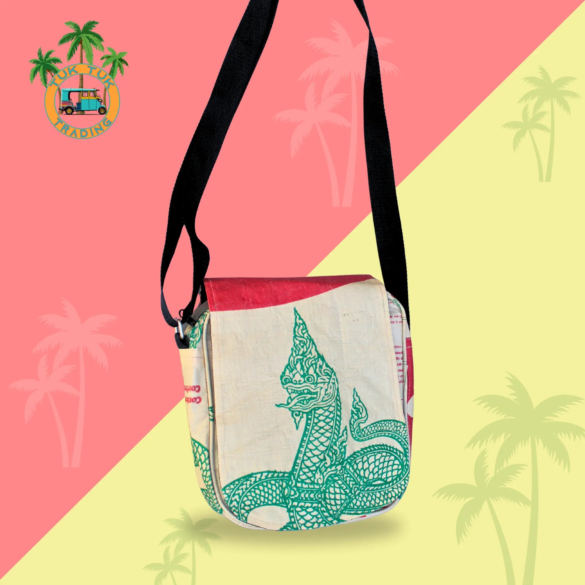 Sling bag with green naga design on a pink and yellow background with palm tree graphics from TukTuk Trading
