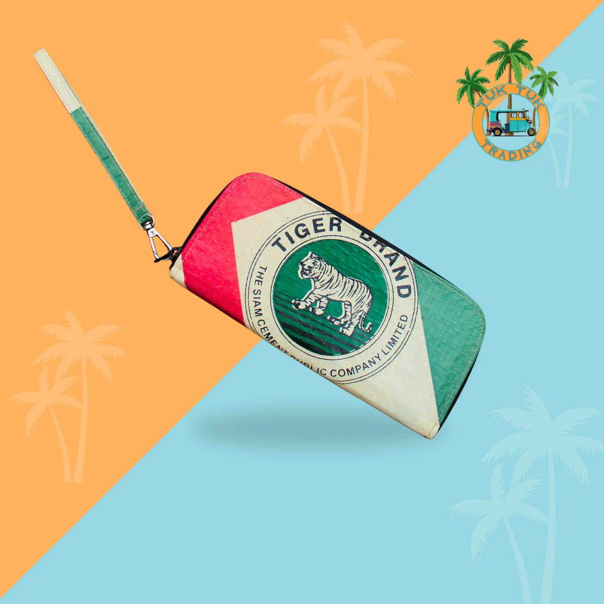 Colorful zip wallet with Tiger Brand logo on a two-tone orange and blue background with palm tree graphics from TukTuk Trading